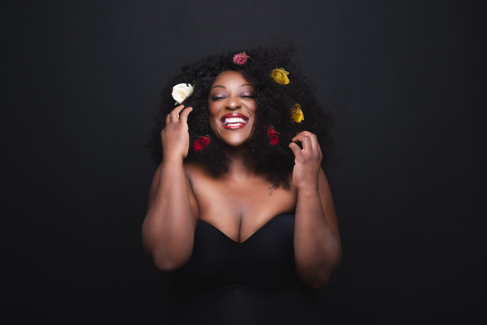 Judi Love laughing, portrait